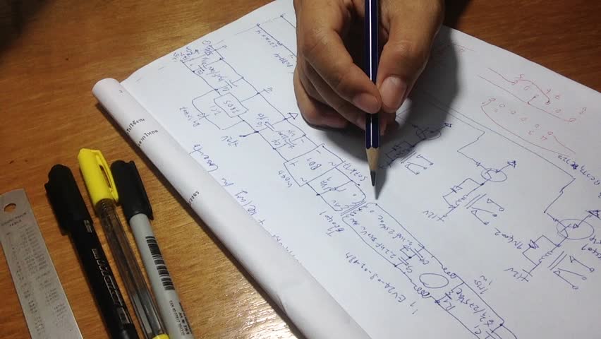 Electronics circuit sketch with pen, pencil and ruler